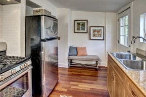 The gas range stove and subway tile reminds everyone who walks into this home of how Ballard was once a fishing village. Put on a cup of coffee and soak in the early 1900s vibe of this cottage.