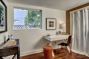 The second main level bedroom is a super bright home office, studio space, or a spot to catch up on your reading.