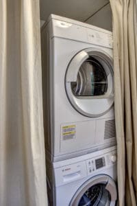 Home boasts a full size energy efficient washer and dryer just off the kitchen.