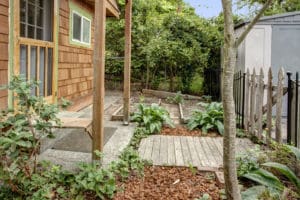 The front garden has a pear, apple, and a golden plum tree. And the best part there is still space for a Victory garden and shared access co-housing the chickens with the neighbors.