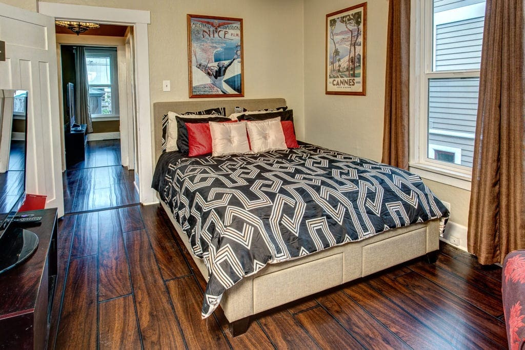 Main level bedroom once again showcases the details of the original charm of the home. 