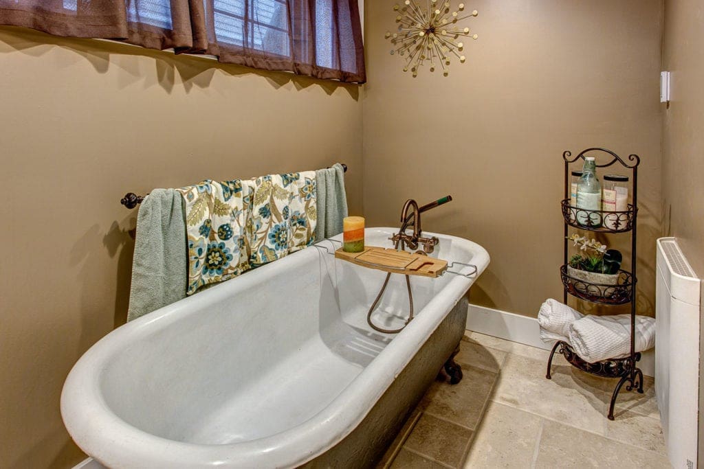 The downstairs bathroom has been renovated to include a stunning clawfoot bathtub. 