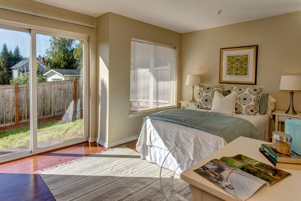 Ground floor bedroom with private bathroom & access to backyard, the perfect guest retreat.