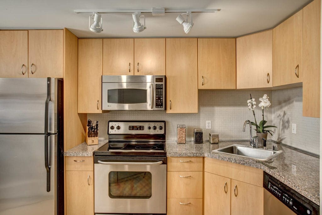 Spacious kitchen with stainless steel appliances.