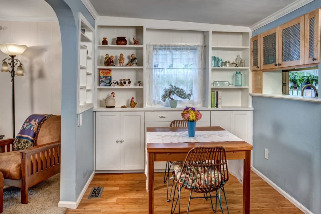 Dining room with built-in shelving and storage.