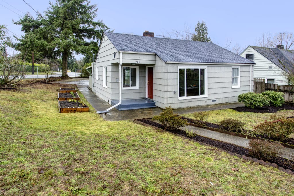 Fully fenced spacious yard at this bungalow home in Lakeridge.