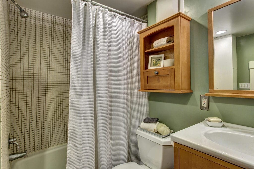 Raised bathroom with closet space & storage.