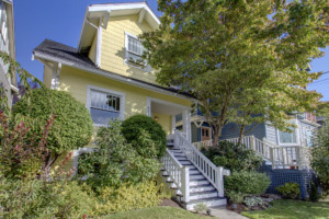 Single family two-story Craftsman home in Phinney Ridge neighborhood of Seattle, Washington. House has mature landscape on level yard.