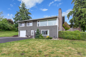 Single family two-story contemporary home in North Beacon Hill neighborhood of Seattle, Washington. House has mature landscape on level yard.