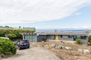 Modern single family home in Shoreline neighborhood of Seattle, Washington. Home has sweeping views of Pueget Sound waterways.