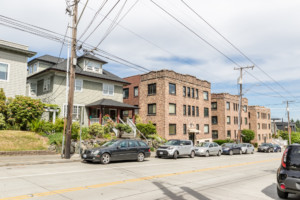 Brick condominium building in Portage Bay Roanoke neighborhood of Seattle, Washington. Building has on-street parking.