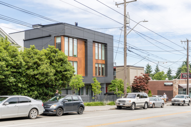 Modern townhouse building in Portage Bay Roanoke neighborhood of Seattle, Washington. Building has on-street parking.
