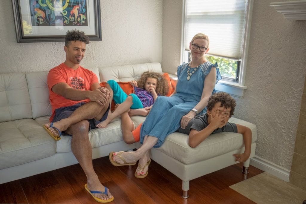 Seattle Home Buyer Stories: Rebecca and Iroro and family chill on the couch