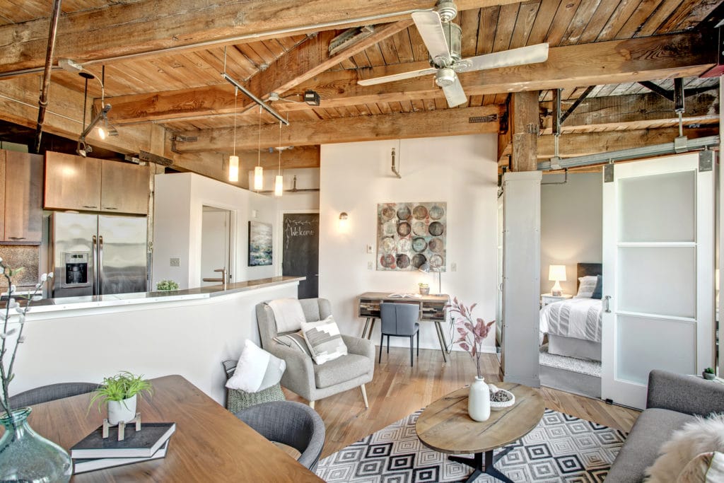Capitol Hill Loft Condo Open Living Area, Stainless Steel Kitchen, Bedroom, and Entry