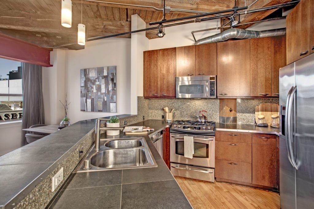 Capitol Hill Loft Condo Dining Area and Stainless Steel Kitchen