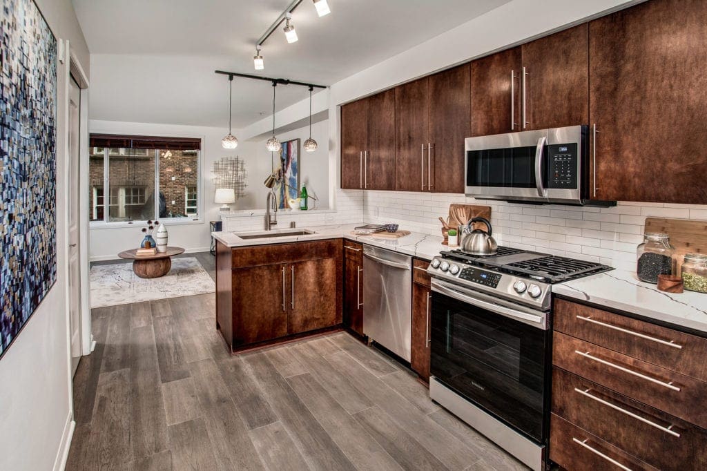 Meritage Capitol Hill Condo Kitchen with Gas Range, Breakfast Bar, Living Area