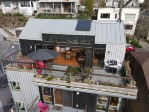 Modern Queen Anne View Home Drone Aerial Rooftop Deck Dining Area Nano Doors Hot Tub Rooftop Garden