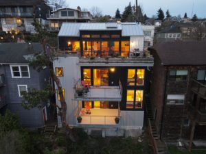 Modern Queen Anne View Home- Twilight View back of house and three levels of living