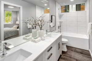 Built Green North Ballard Modern Townhome Full Bathroom view of vanity, toilet and tub shower