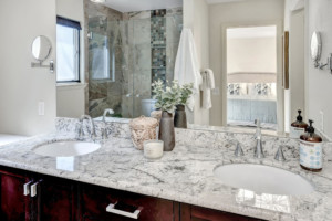 Kenmore Home Primary Bathroom, two sinks and large cabinets under the mirror for lots of storage