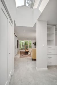 Kenmore Mid Century Home Veritical image of the primary suite with the skylights
