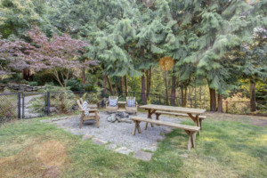 dining picnic table in the back yard with greenspace