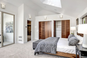 Leschi Townhouse Primary Bedroom Wall of Stunning Wood Closets