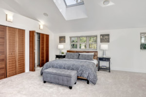 Leschi Townhouse primary bedroom Vaulted Ceilings and skylight