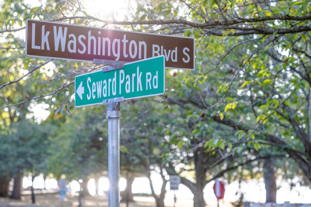 Southeast Seattle close to Seward park. Sign showing Lake Washington Blvd and Seward Park at sunset. 