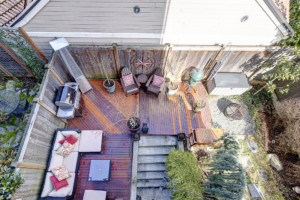 Drone view of exterior patio and deck of Columbia City townhouse.