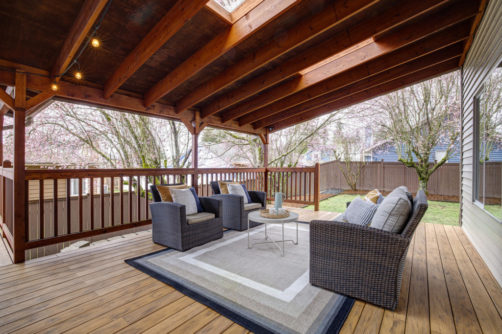Photo of Lynnwood home showing patio deck with lounge area and view two fenced area.
