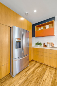 Kitchen with fridge and wood flooring