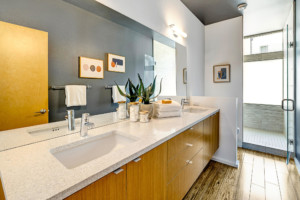Large half bath with double sinks and long mirror