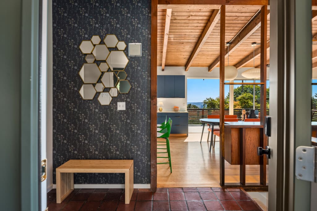 Original wood details in the entryway of this custom built mid-century modern home in South Seattle