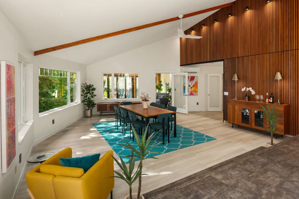Vaulted ceilings and a custom built slat wall in the dining room of this Redmond WA home