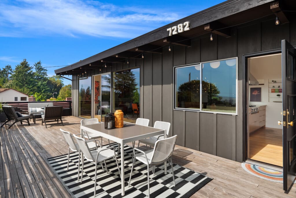 Entertaining deck off the main living space of a Seattle custom built mid-century modern home